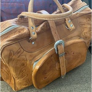 Custom, western, handmade leather travel bag. Medium size, buckskin color.